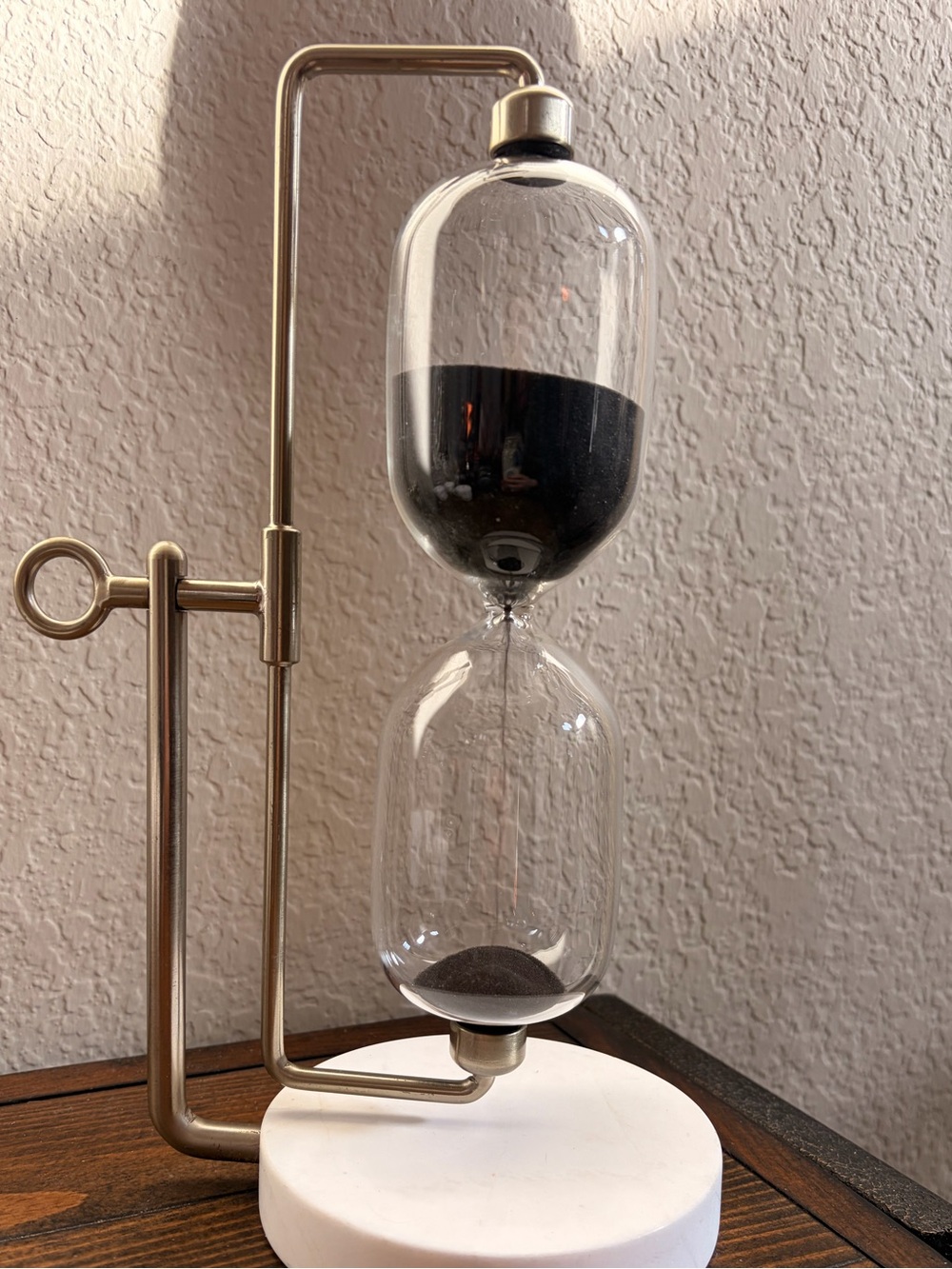 Brass-Finish Hourglass Timer with Black Sand and White Base